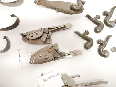 Lot 239 - Collection of gun locks and butt plates.
