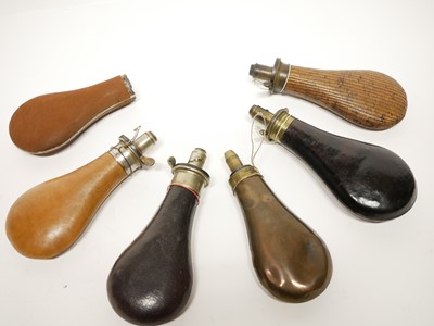 Lot 210 - Five powder flasks and a flask body