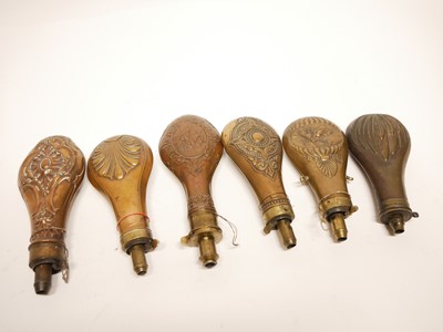 Lot 241 - Six embossed copper and brass powder flasks