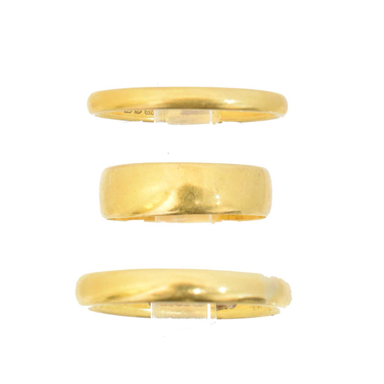 Lot 62 - Three 22ct gold band rings