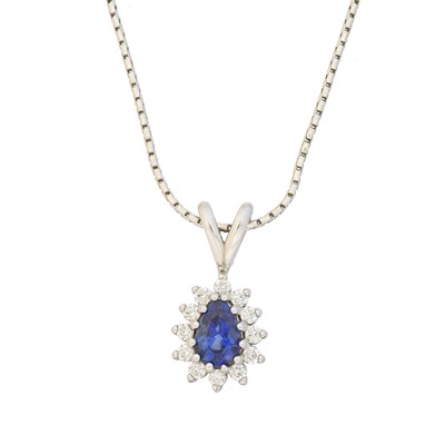 Lot 23 - An 18ct gold synthetic sapphire and diamond pendant