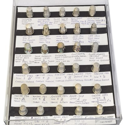 Lot 150 - A collection of silver and white metal thimbles