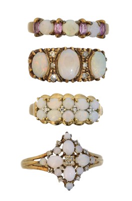 Lot 57 - Four 9ct gold opal dress rings