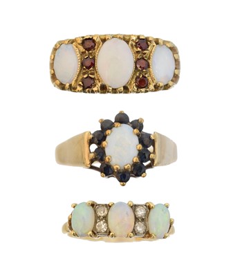 Lot 59 - Three 9ct gold opal dress rings