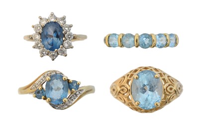 Lot 149 - Four 9ct gold blue topaz dress rings