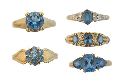 Lot 141 - Five 9ct gold blue topaz dress rings
