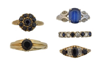 Lot 142 - Five 9ct gold blue gem-set dress rings