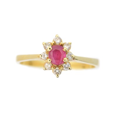 Lot 47 - A ruby and diamond cluster ring