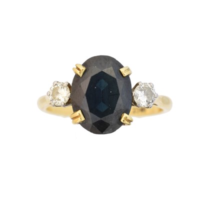 Lot 48 - A sapphire and diamond three stone ring