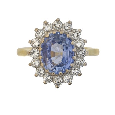 Lot 75 - An 18ct gold Sri Lankan sapphire and diamond cluster ring