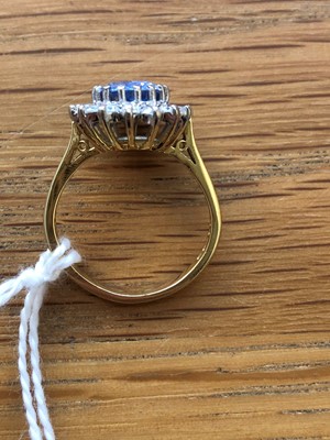 Lot 75 - An 18ct gold Sri Lankan sapphire and diamond cluster ring
