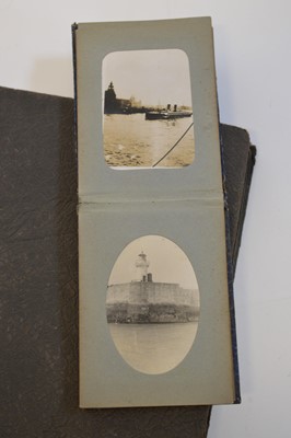 Lot 56 - Nautical, British tourist and miscellaneous family postcards in two albums