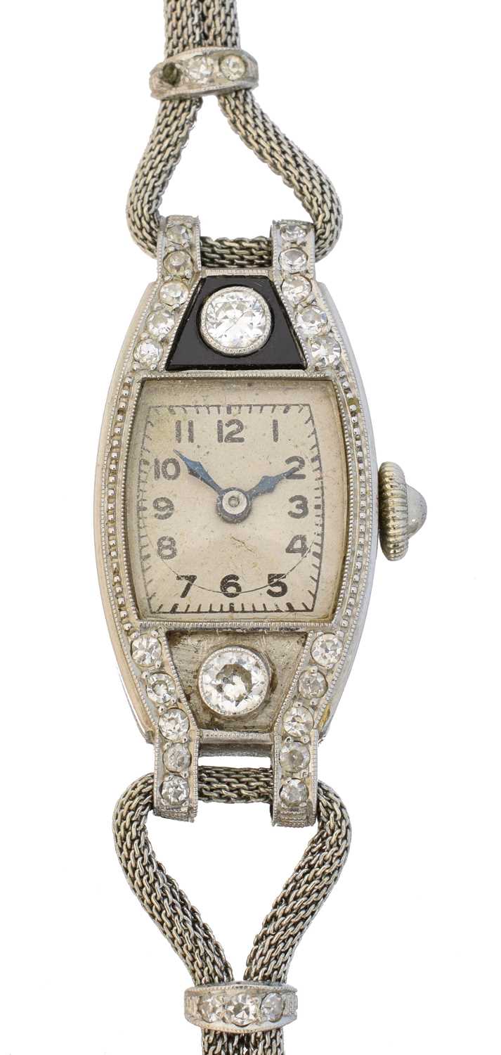 Lot An early 20th century platinum diamond and onyx cocktail watch by Marvin