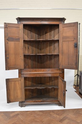 Lot 319 - George III oak floor standing corner cupboard