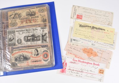 Lot 174 - Two albums and various loose foreign banknotes and cheques.