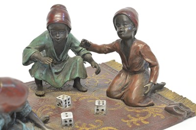 Lot 3 - Cold Painted Bronze Figure Group of three boys seated on a carpet playing with dice