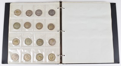 Lot 14 - Large blue album of various British coinage to include selection of silver and later coinage.