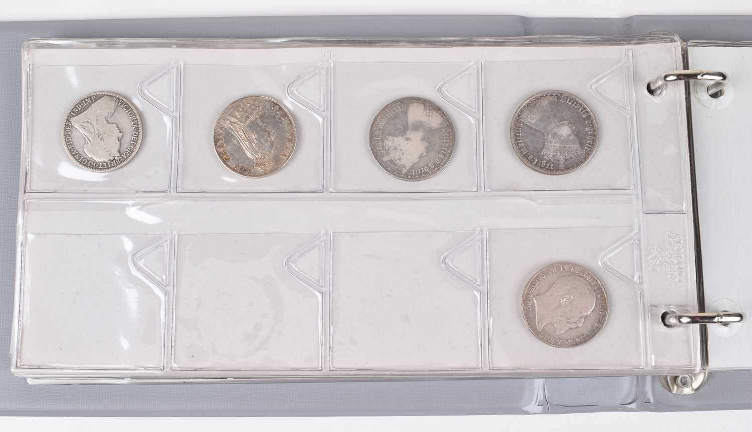 Lot 24 - Red album of various lower denomination historical British coinage.