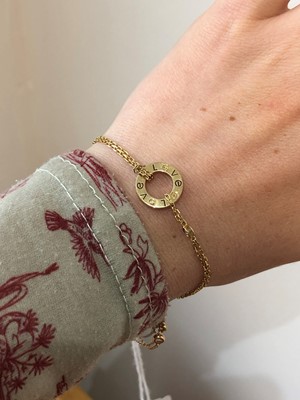 Lot 49 - An 18ct gold diamond 'Love' bracelet by Cartier