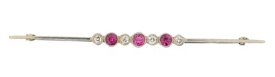 Lot 16 - An early 20th century ruby and diamond bar brooch