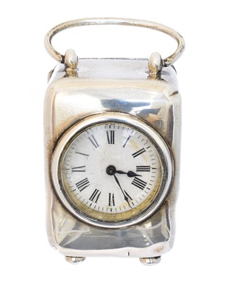 Lot 122 - An Edward VII silver cased miniature travel clock