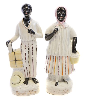 Lot 133 - Staffordshire figures of Uncle Tom and Aunt Chloe.