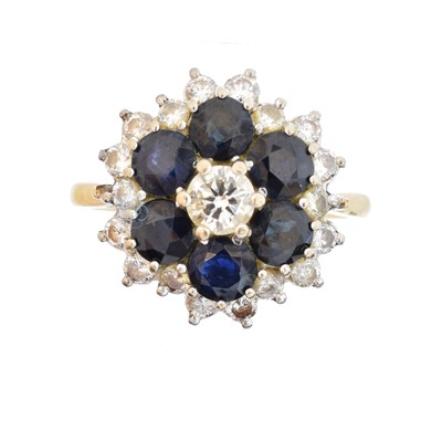 Lot 145 - A sapphire and diamond cluster ring