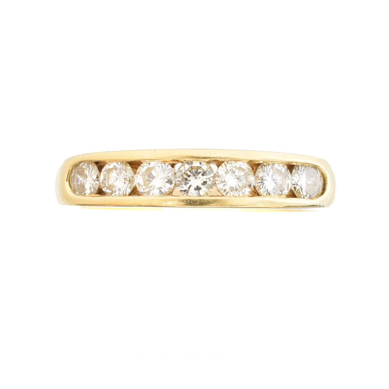 Lot 102 - An 18ct gold diamond band ring