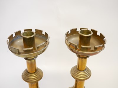 Lot 221 - Pair of Victorian gothic brass candlesticks