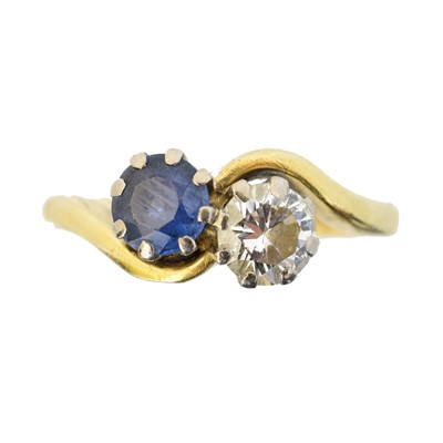 Lot 133 - An 18ct gold sapphire and diamond crossover ring