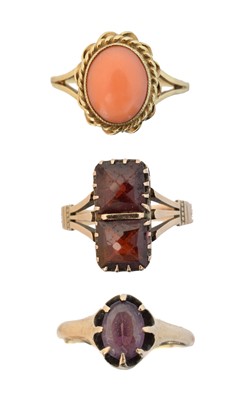 Lot 65 - Three gem-set dress rings