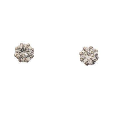 Lot 15 - A pair of laser-drilled diamond stud earrings