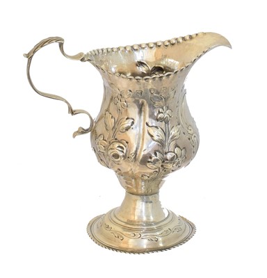 Lot 104 - A George III silver cream jug