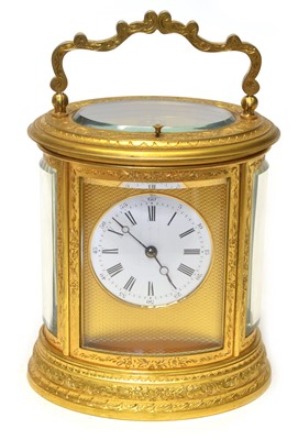 Lot 184 - Late 19th-century gilded brass carriage clock