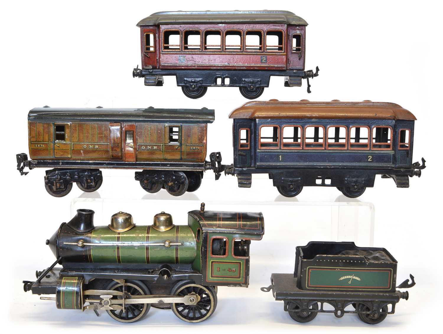 Lot 128 - Bing tinplate locomotive and tender plus three coaches