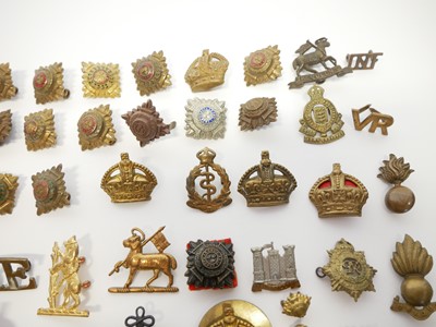 Lot 255 - Collection of cap badges, collar titles and uniform appointments