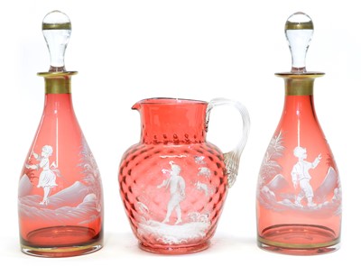 Lot 150 - Pair of Mary Gregory cranberry glass decanters and a water jug