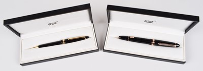Lot 20 - Two Montblanc pens, two Montblanc leather pen pouches and an ink bottle (5).