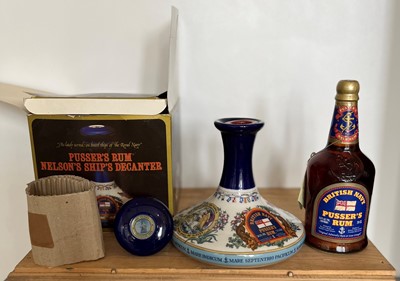 Lot 74 - 2 Bottles including perfect boxed 1 Litre Ship’s Decanter Pussers Rum