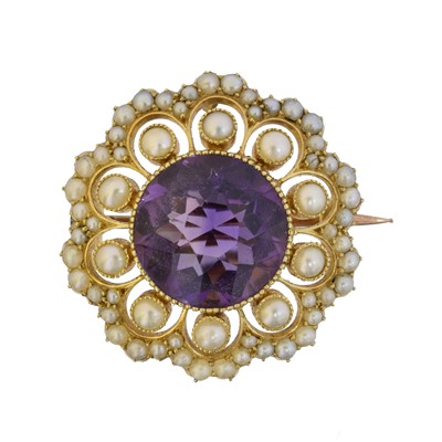 Lot 12 - An early 20th century amethyst and split pearl brooch