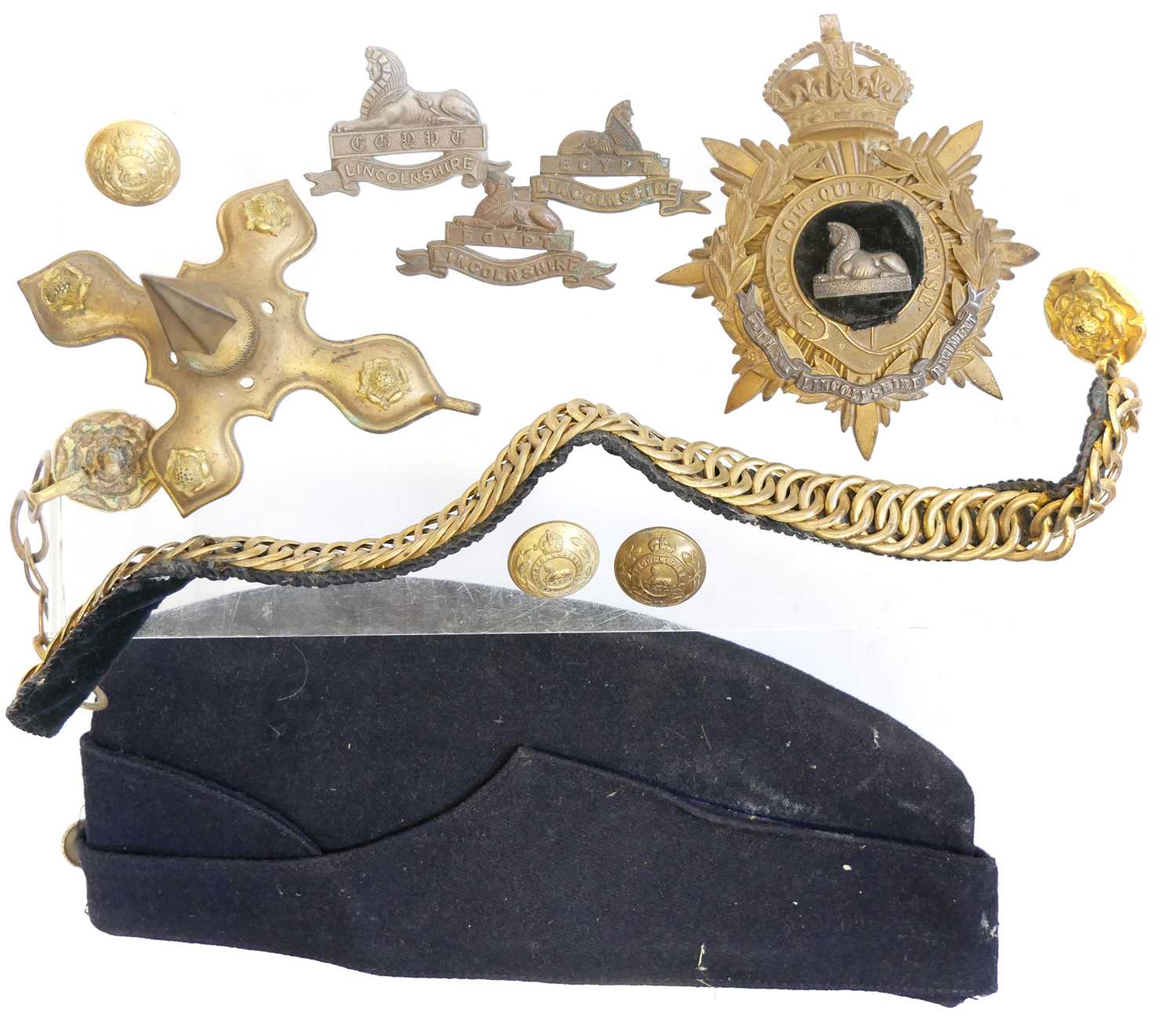 Lot 391 - The Lincolnshire Regiment Cloth helmet fittings and other uniform items