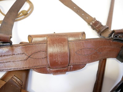 Lot 379 - Sam Browne, Webley revolver holster, ammunition pouch, lanyard, and swagger stick