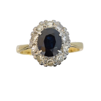 Lot 12 - A sapphire and diamond cluster ring
