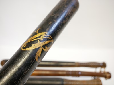 Lot 396 - Four truncheons, and hand cuffs