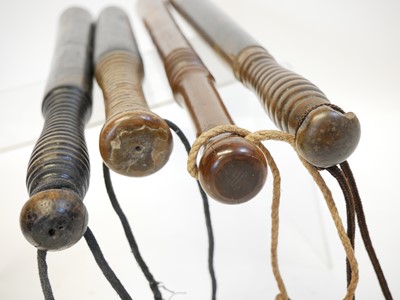 Lot 396 - Four truncheons, and hand cuffs