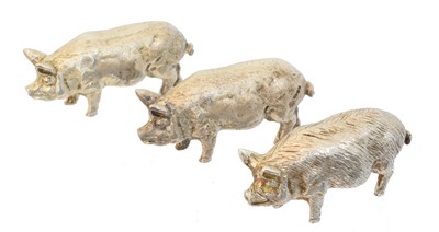 Lot 85 - Three Elizabeth II silver models of pigs