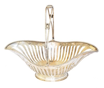 Lot 98 - An Edward VII silver swing handled basket