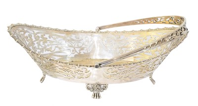 Lot 103 - An Edward VII silver swing handled basket