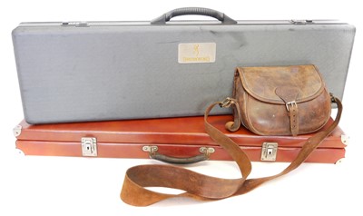 Lot 235 - Two shotgun hardcases and a leather cartridge bag