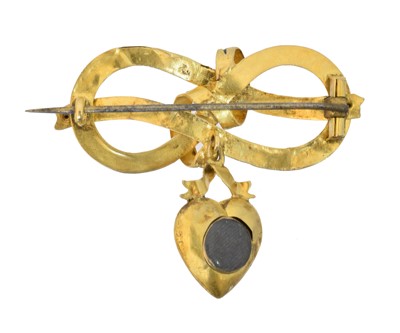 Lot 5 - A Victorian enamel and split pearl locket brooch